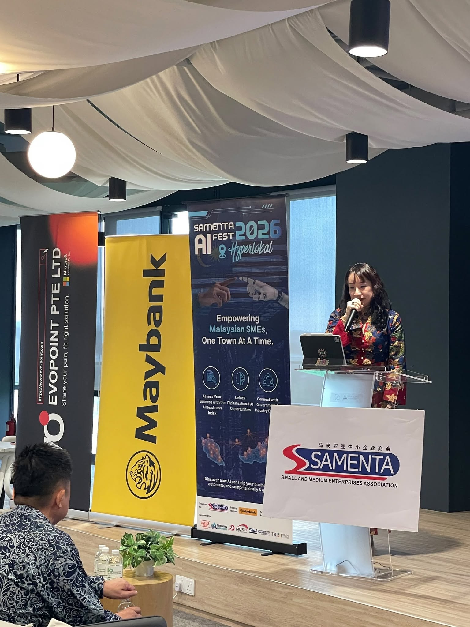 Southern AI Forum speaker presenting at podium
