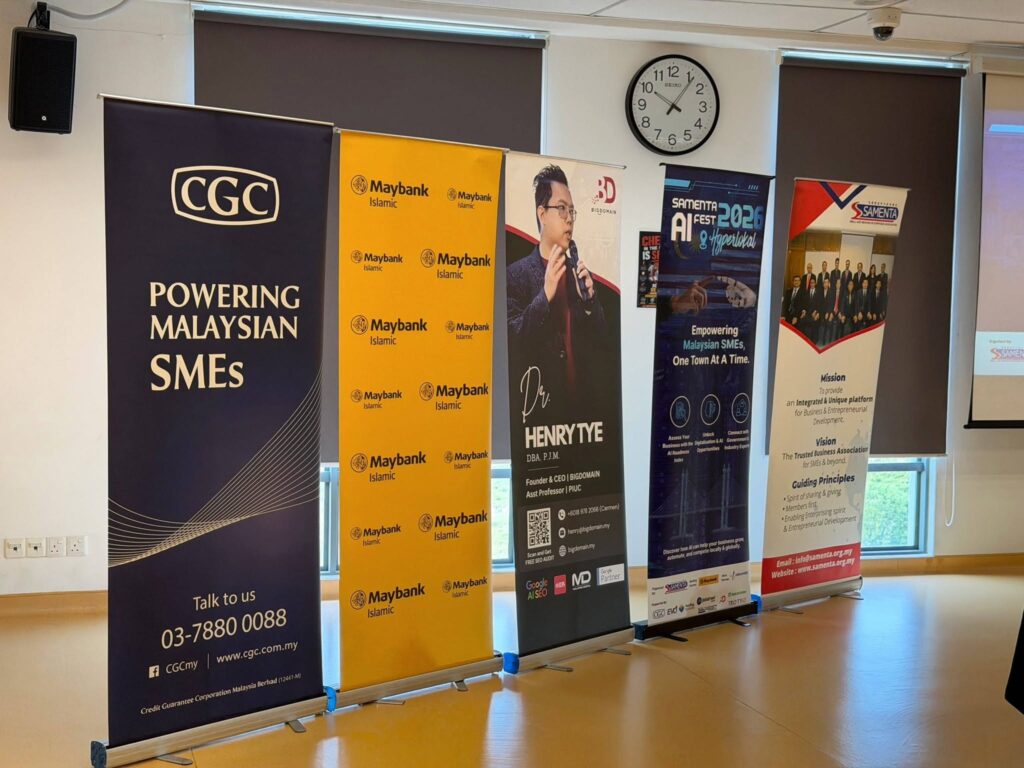 Partner showcase banners at the SAMENTA Hyperlokal AI Fest in Batu Kawan, Penang