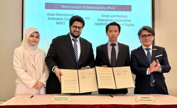 AIAC and SAMENTA Northern Region representatives holding the signed Memorandum of Understanding at Road to Kainos - The Northern Edition in Penang